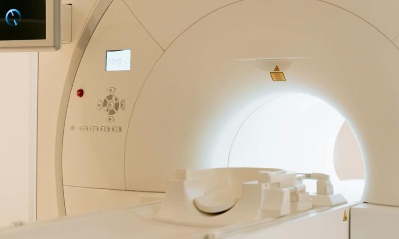 Close-up view of a modern CT scanner in a healthcare facility.