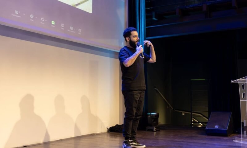 Energetic speaker delivering a talk at a corporate event
